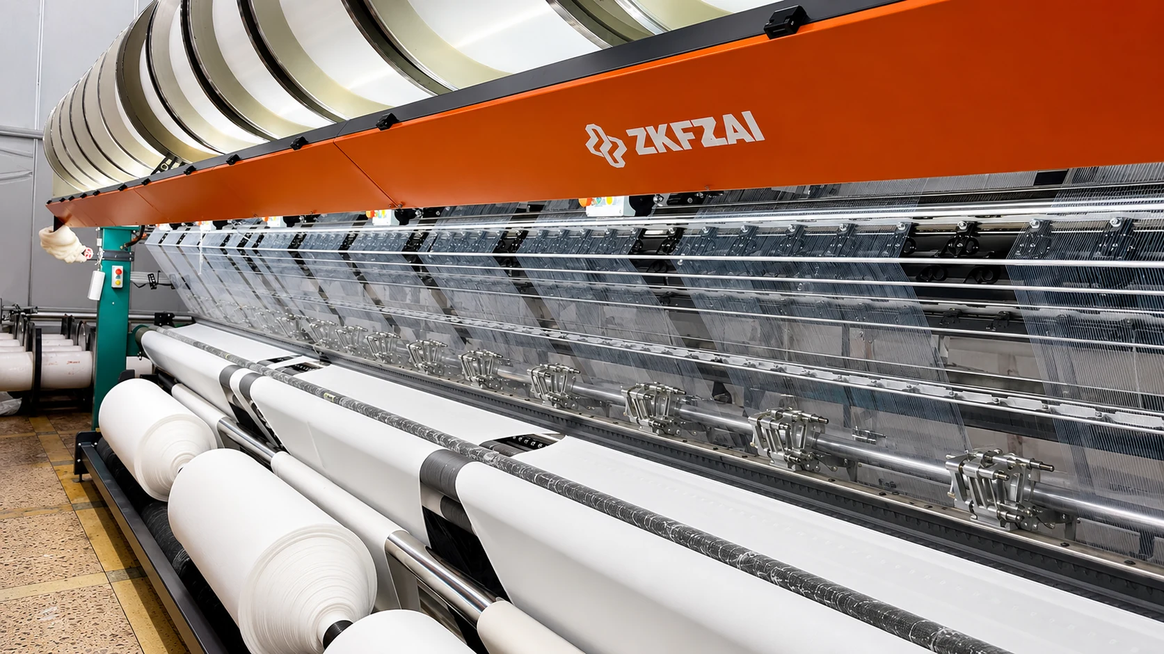 Fabric knitting machine and fabric roll production details