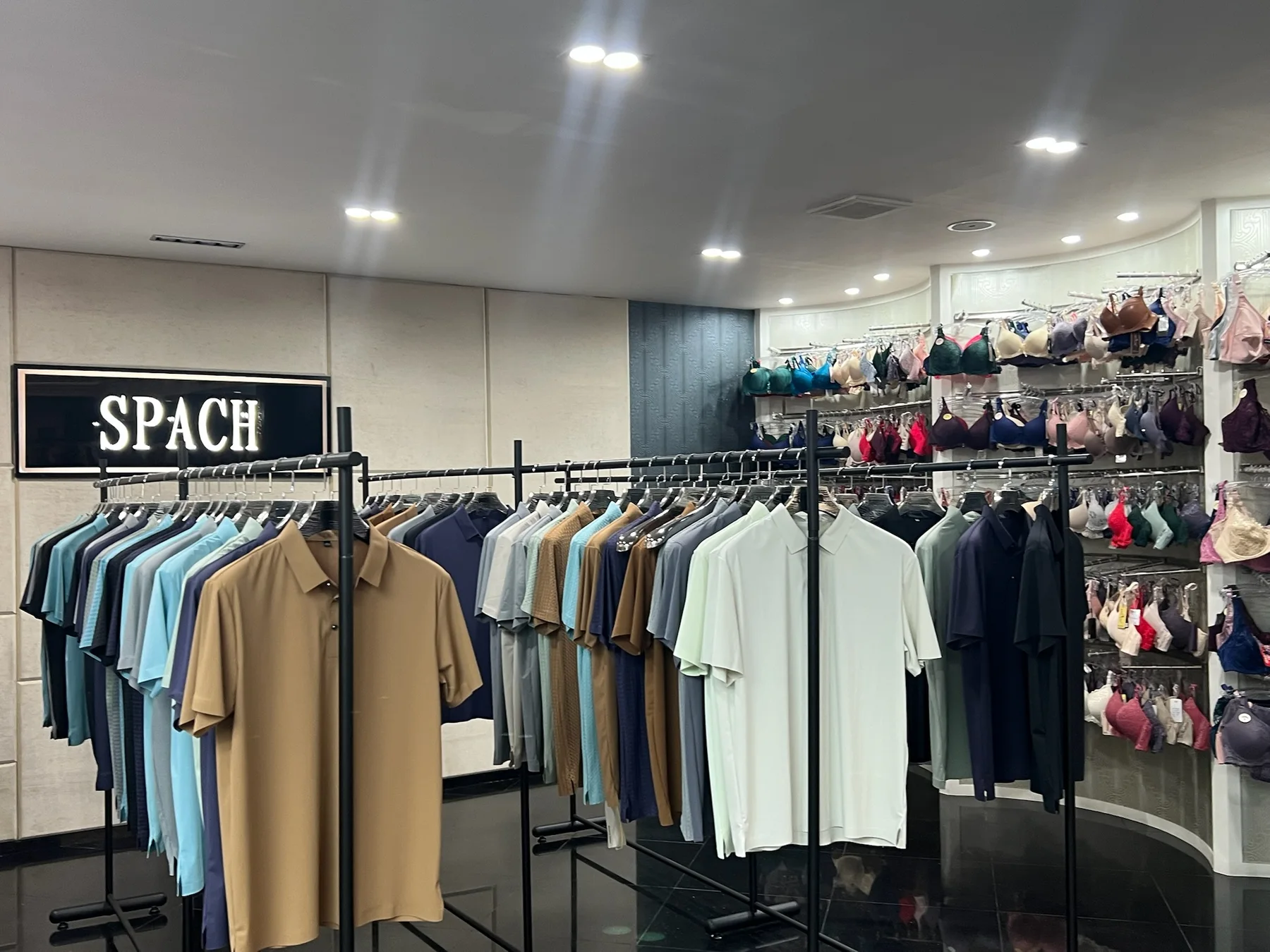 SPACH branded showroom space with garment samples