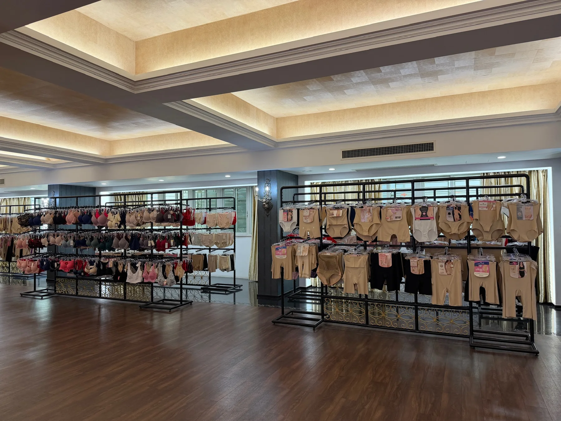 Overview of Guangwei sample room with multi-series lingerie and shapewear display